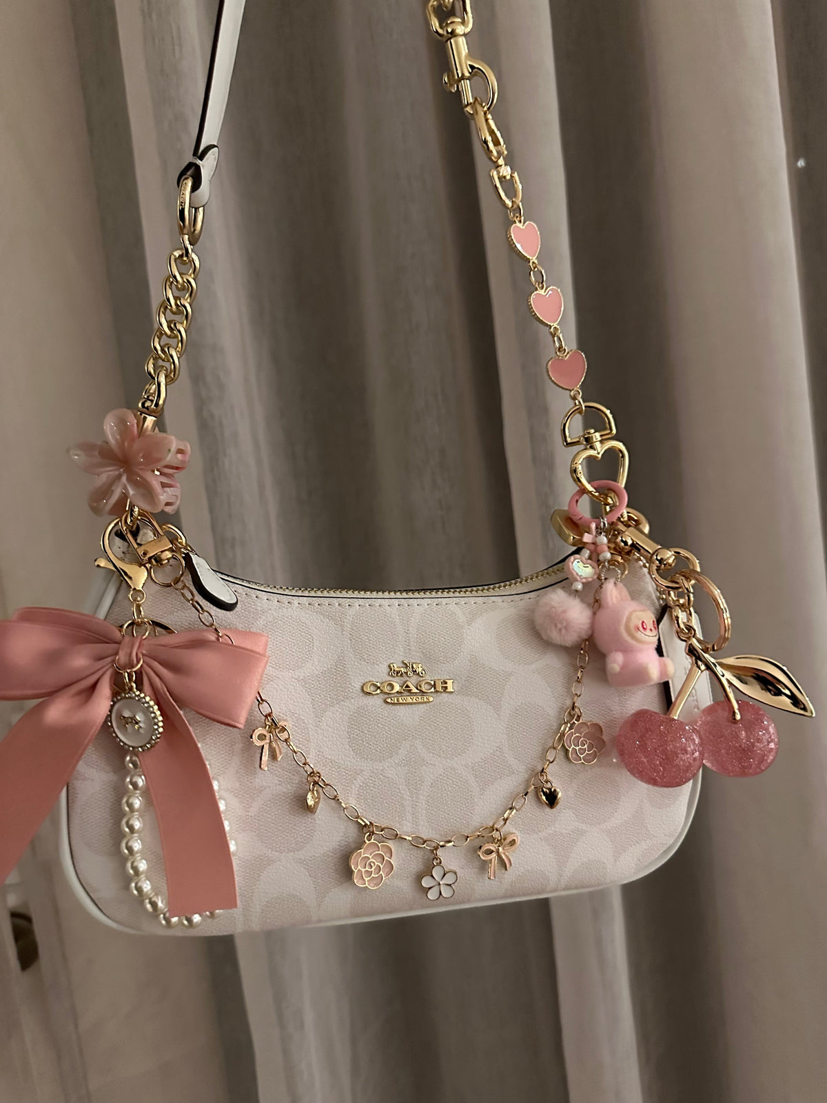 Pink chain bag gold charm accessories